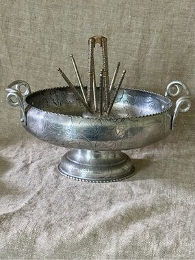 Vintage hammered aluminum floral footed nut bowl with utensils